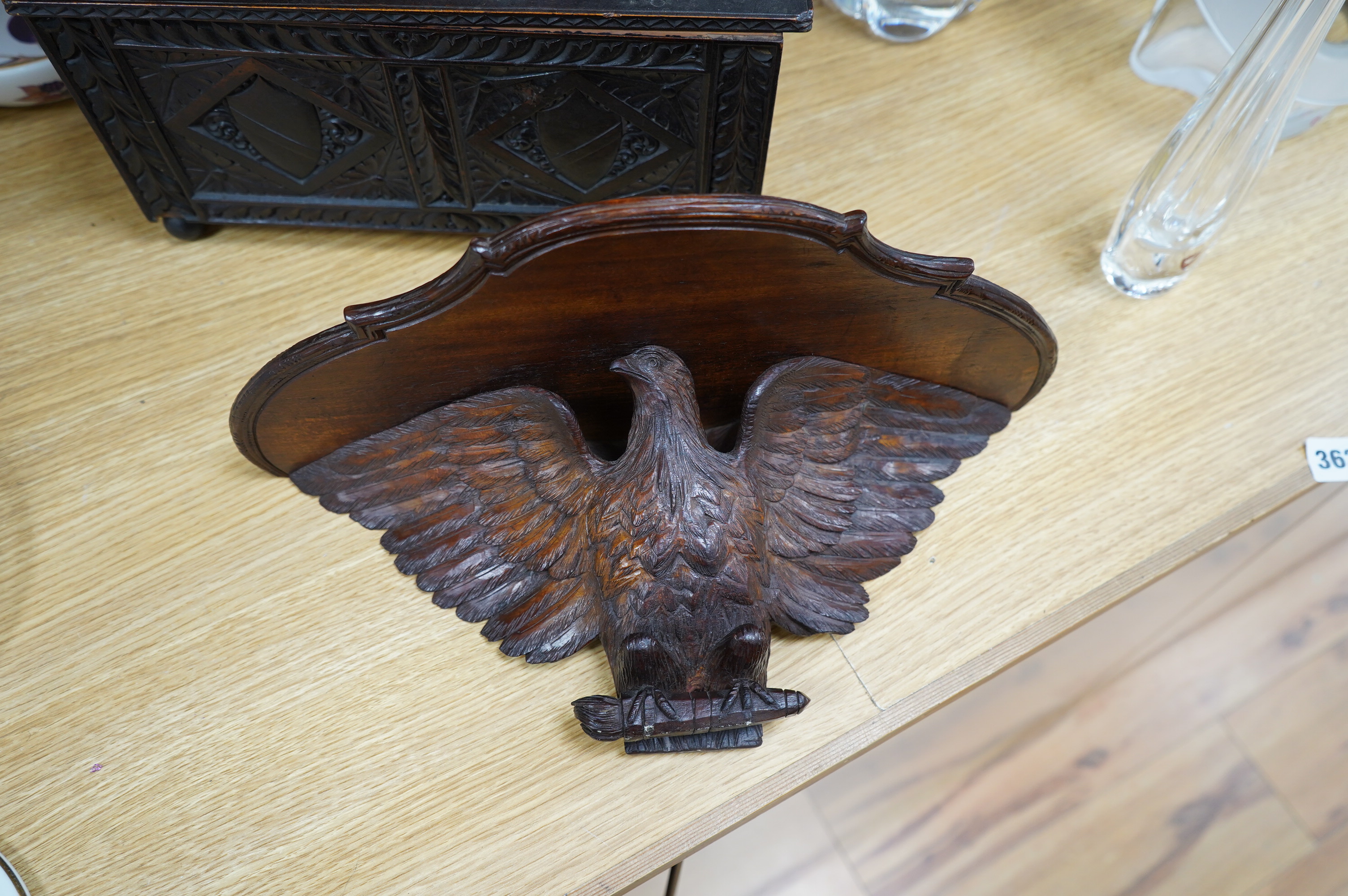 A late 19th century carved walnut and beech eagle wall bracket and a miniature coffer, largest 37cm wide. Condition - fair